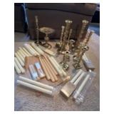 Brass candlesticks and candles. Some of the