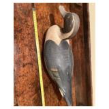 Old wood duck decoy. Has a red s on the bottom