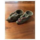 Pottery type green shoes with goat head