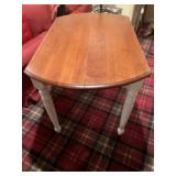 Round drop leaf table. Has one leaf