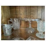 Glassware including cake plate to pitchers and
