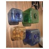 Four colored appear to be hand blown glass