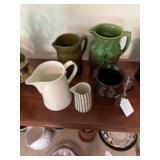 Five pottery pitchers