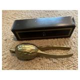 Brass walnut cracker. Tag in box says Reed &