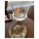 Two glass globes in silver plate dish