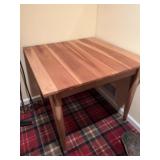 Square table. Appears to be cedar