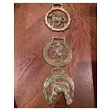 Three brass ornaments