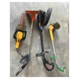 Three electric trimmers and hedge trimmer