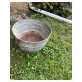 Old wash tub. Rusted out bottom
