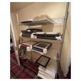 Shelving unit on rollers. 75 inches tall by 48
