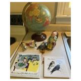 Globe, old man and rocker bank full of pennies