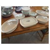 White casserole dishes with lids. Items in