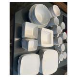 Set of white dishes. Includes eight dinner