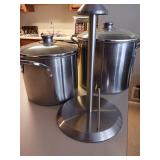 Two stock pots and paper towel holder pots have
