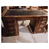 Desk 56 in by 26 in wide leather like top and