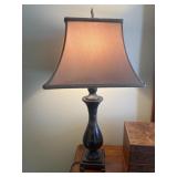 Lamp with metal base and heavy stone.