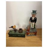 Two cast-iron banks. Kicking mule and uncle Sam.