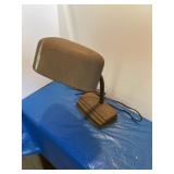 Vintage metal desk lamp with gooseneck arm.