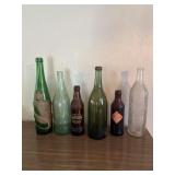 Vintage bottles, including orange, crush, olive