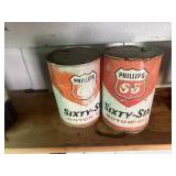 Two Philip 66 motor oil cans empty