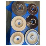 Five antique butter churn lids and one number 4