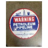 Vintage metal warning, petroleum pipeline sign.