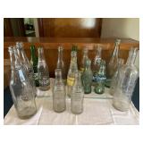 16 old soda bottles incl. Tiger Brand City