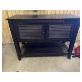 Dropleaf serving cabinet/buffet. Drops on one