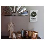 Multiple figurines and two wall hangings as shown
