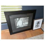 Two pieces, black and white wall art appear to be