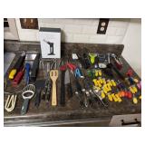 Kitchen gadgets, including several pairs of corn