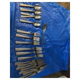 Oneida flatware includes nine dinner forks, seven