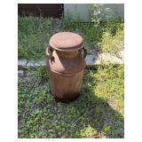 Old rusty milk can