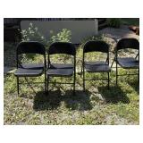 Four metal folding chairs
