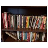 Two shelves of mostly cookbooks