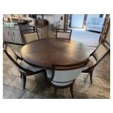 Round dining table and 6 chairs. table is 58