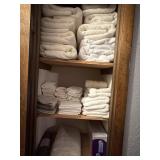 Towels, washcloths, bathmat, and white bath rug