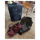 American Tourister luggage and three other bags
