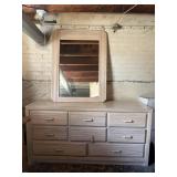 Dresser with mirror. Is in basement