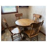 Round dining table and four chairs