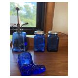 Cobalt blue salt and pepper shakers while hanging