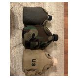 3 Canteens. One with the green cover is