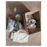 Baby doll clothes, pacifiers, blanket, and bottle