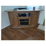 Corner entertainment center glass door at the