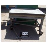 GRANITE TABLE ON WHEELS, 36" X 48" GRANITE TABLE ON WHEELS, 36" X 48"