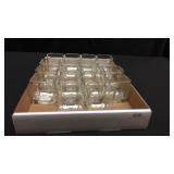 A box of 18 glass votive holders