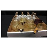 Box of misc.  seven colored votive holders and 1