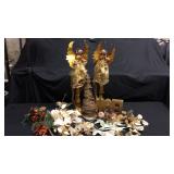 Assorted gold Christmas Decor and two pedestal