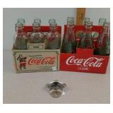 Lot of vintage Coca-Cola bottles with opener