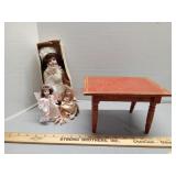 Little red wood table, 3 decorative dolls